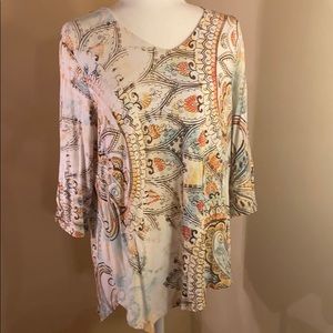 Soft pastels in this Chico’s asymmetrical tunic